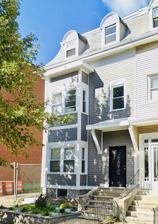 44 Saratoga St, Boston, MA 02128 - second empire-style home with mansard roof, entry steps, and a shingled roof