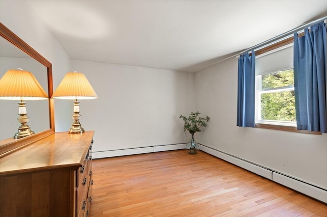unfurnished room with light wood finished floors