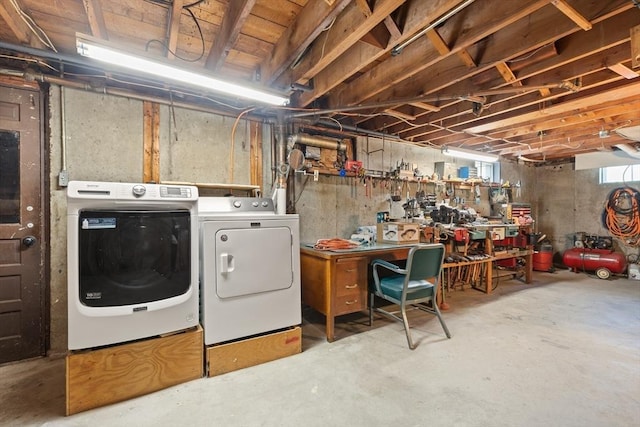 basement featuring separate washer and dryer and a workshop area