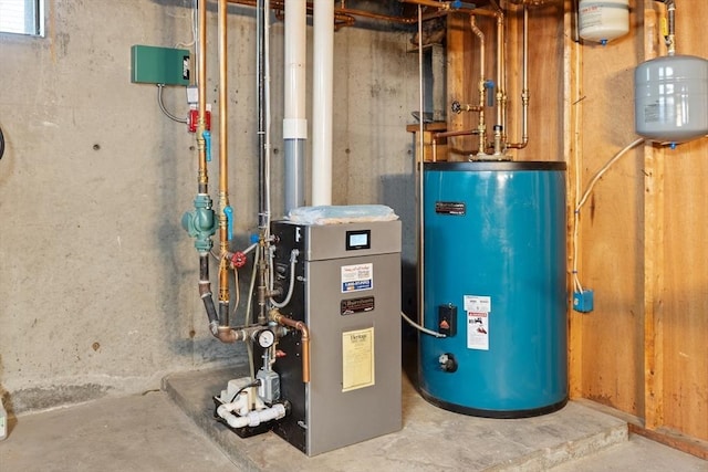utility room featuring gas water heater and a heating unit
