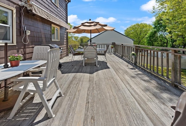 wooden deck with outdoor dining area
