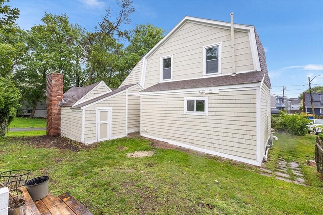 136 Locust Way, Winthrop, MA 02152 - back of house featuring roof with shingles, a yard, and a gambrel roof