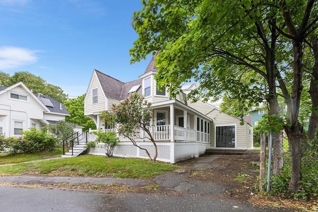 136 Locust Way, Winthrop, MA 02152 - view of front of property with covered porch and a shingled roof