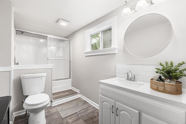 136 Locust Way, Winthrop, MA 02152 - bathroom with vanity, toilet, shower / bath combination with glass door, and wood finished floors