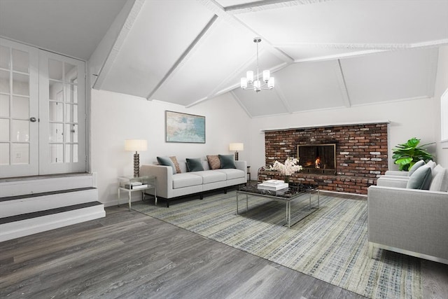 136 Locust Way, Winthrop, MA 02152 - living area with wood finished floors, a chandelier, a brick fireplace, and baseboards