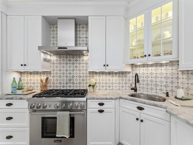 92 Warren St Unit W-1, Boston, MA 02129 - kitchen with stainless steel range, wall chimney exhaust hood, a sink, white cabinets, and ornamental molding