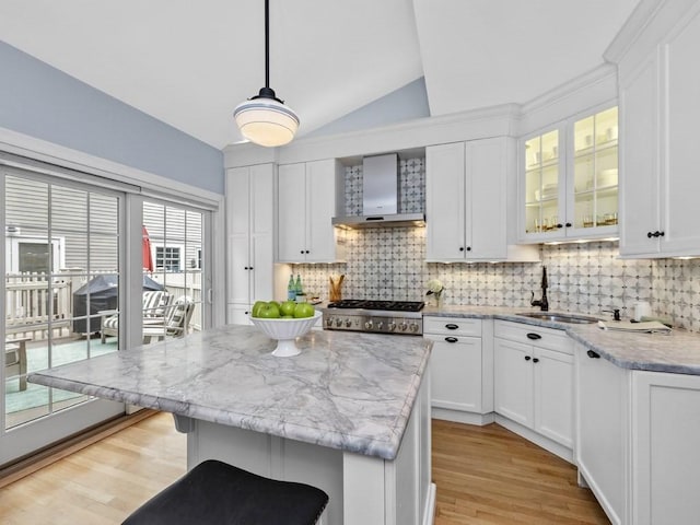 92 Warren St Unit W-1, Boston, MA 02129 - kitchen with wall chimney range hood, lofted ceiling, a sink, backsplash, and light wood-style floors