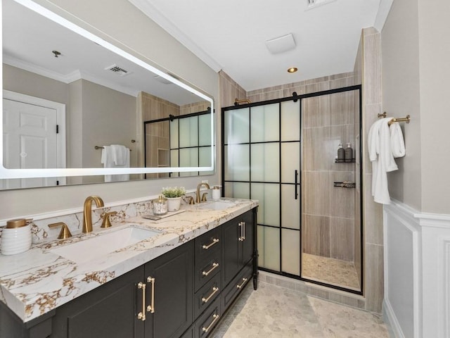 92 Warren St Unit W-1, Boston, MA 02129 - bathroom featuring a shower stall, double vanity, and crown molding