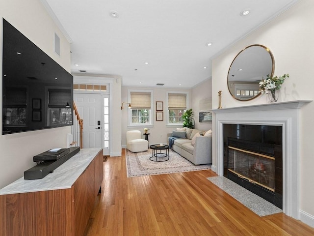 92 Warren St Unit W-1, Boston, MA 02129 - living area with light wood finished floors, a fireplace with flush hearth, recessed lighting, and baseboards