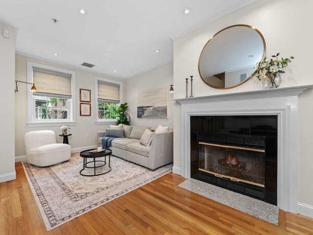 92 Warren St Unit W-1, Boston, MA 02129 - living area with ornamental molding, wood finished floors, a fireplace, baseboards, and recessed lighting