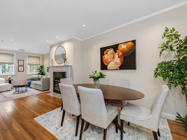 92 Warren St Unit W-1, Boston, MA 02129 - dining space featuring wood finished floors, a fireplace with flush hearth, recessed lighting, ornamental molding, and baseboards