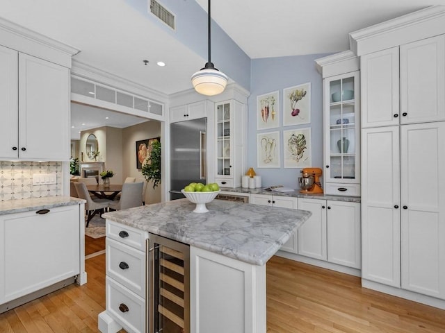 92 Warren St Unit W-1, Boston, MA 02129 - kitchen with wine cooler, light wood-type flooring, and white cabinetry