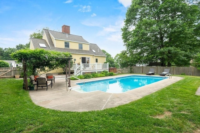 2 Dewey St, Amesbury, MA 01913 - view of swimming pool with a wooden deck, a fenced backyard, and a patio