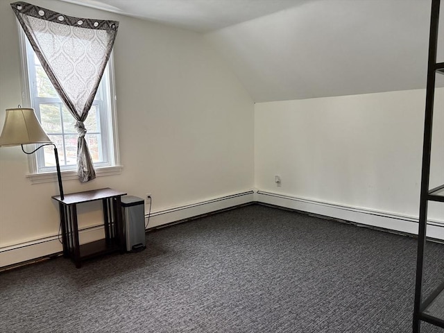 bonus room featuring vaulted ceiling and dark colored carpet