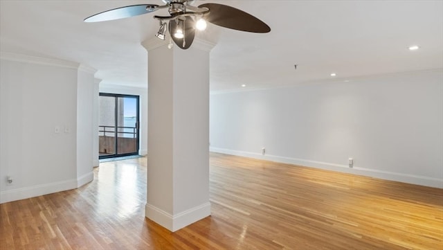 empty room with ceiling fan, light hardwood / wood-style flooring, and crown molding