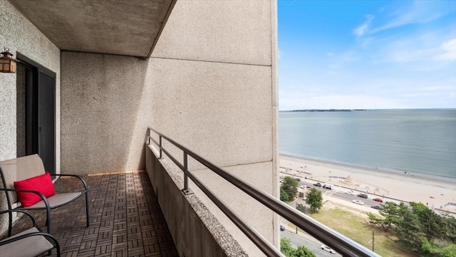 balcony with a view of the beach and a water view