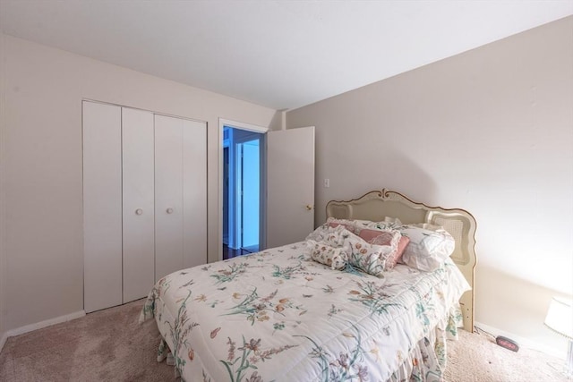 carpeted bedroom featuring a closet