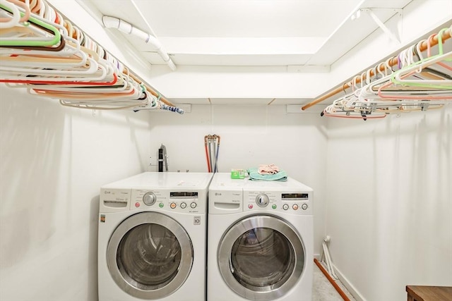 washroom with laundry area and washer and dryer