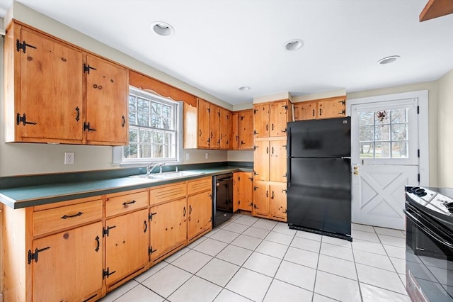 kitchen with light tile patterned floors, black appliances, a sink, and recessed lighting