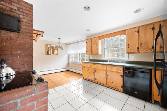 kitchen featuring light tile patterned floors, dishwasher, hanging light fixtures, baseboard heating, and a sink