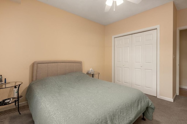 carpeted bedroom featuring a closet and ceiling fan