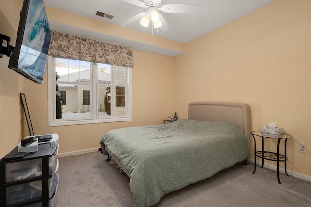 bedroom featuring ceiling fan and light carpet