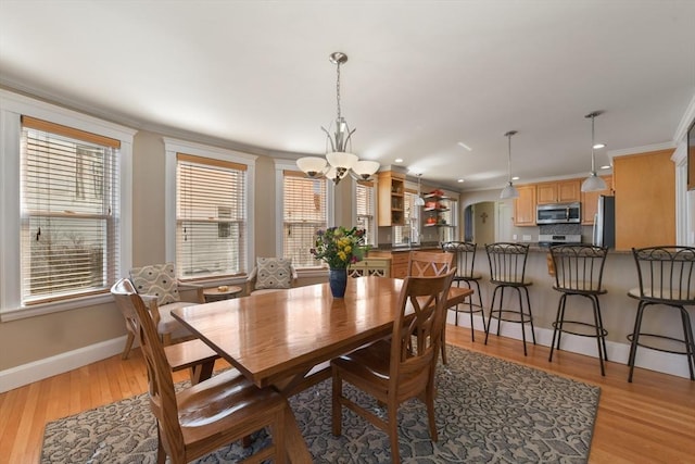 28 Fletcher St Unit 1, Boston, MA 02131 - dining space with ornamental molding, a chandelier, baseboards, light wood finished floors, and recessed lighting