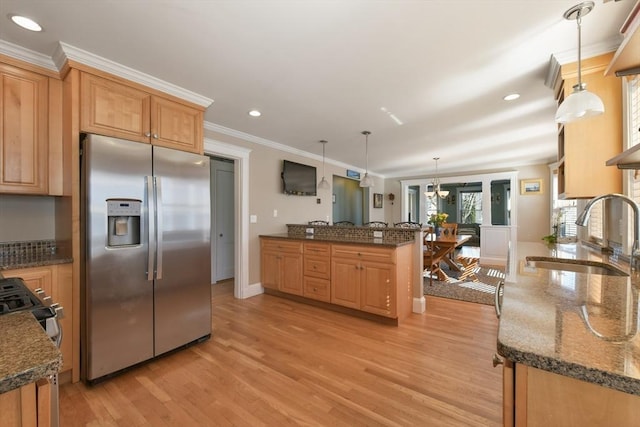28 Fletcher St Unit 1, Boston, MA 02131 - kitchen featuring stainless steel fridge, a sink, a peninsula, light wood-style floors, and ornamental molding