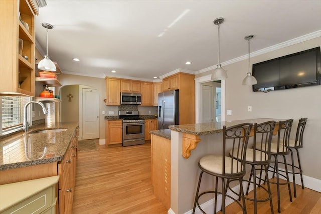 28 Fletcher St Unit 1, Boston, MA 02131 - kitchen with appliances with stainless steel finishes, a sink, light wood finished floors, open shelves, and a kitchen breakfast bar