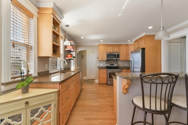 28 Fletcher St Unit 1, Boston, MA 02131 - kitchen featuring stainless steel appliances, a sink, a kitchen bar, open shelves, and recessed lighting