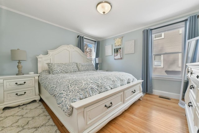 28 Fletcher St Unit 1, Boston, MA 02131 - bedroom featuring light wood finished floors, ornamental molding, and baseboards