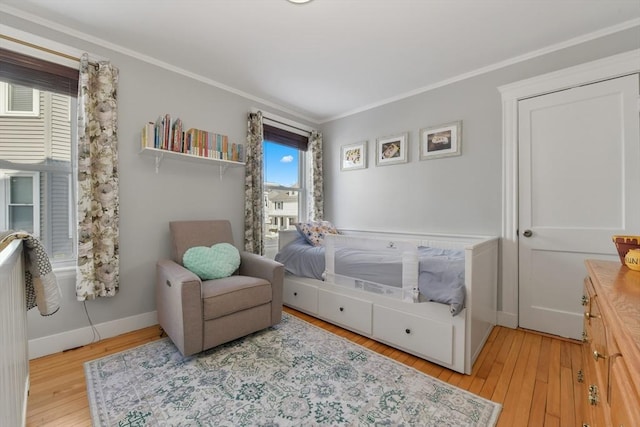 28 Fletcher St Unit 1, Boston, MA 02131 - bedroom featuring crown molding, light wood-style flooring, and baseboards