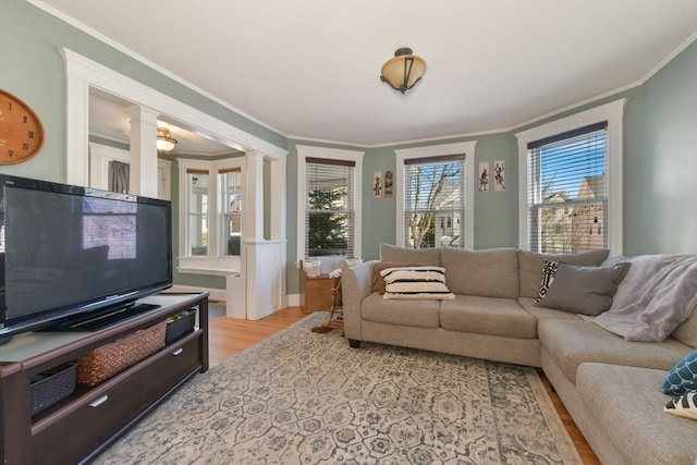 28 Fletcher St Unit 1, Boston, MA 02131 - living area with light wood-type flooring, decorative columns, and crown molding