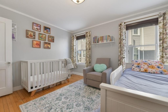 28 Fletcher St Unit 1, Boston, MA 02131 - bedroom featuring crown molding, wood-type flooring, and baseboards