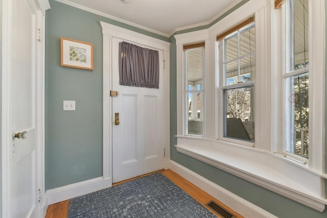 28 Fletcher St Unit 1, Boston, MA 02131 - foyer featuring baseboards, light wood-style floors, plenty of natural light, and crown molding