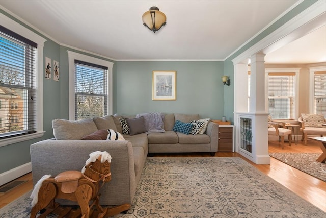 28 Fletcher St Unit 1, Boston, MA 02131 - living area with wood finished floors, ornamental molding, and decorative columns
