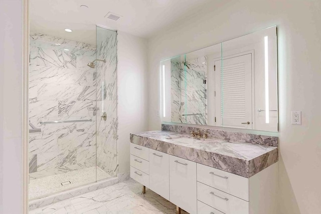 full bathroom featuring marble finish floor, a marble finish shower, recessed lighting, visible vents, and vanity