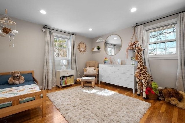 bedroom featuring recessed lighting and wood finished floors