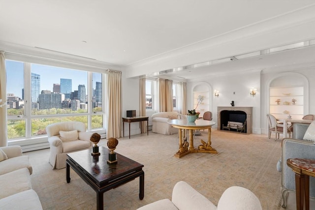 living area with light colored carpet, a city view, and a fireplace