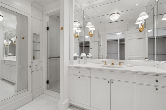 bathroom with vanity, tile patterned floors, crown molding, and a stall shower