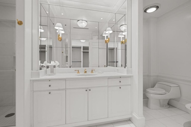 full bathroom featuring crown molding, vanity, a shower stall, and toilet