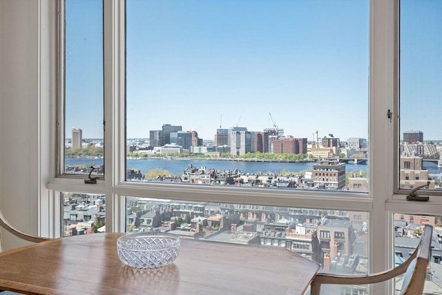 interior space featuring a view of city and a water view