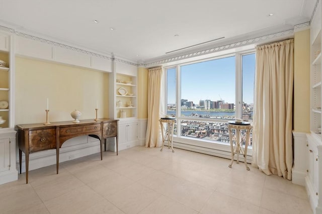 home office with crown molding, built in features, a water view, and light tile patterned floors