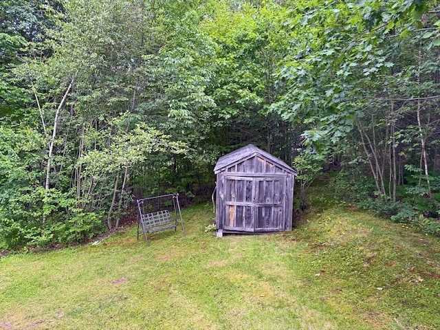 19 Orange Rd, Northfield, MA 01360 - view of grassy yard featuring a storage unit and a wooded view