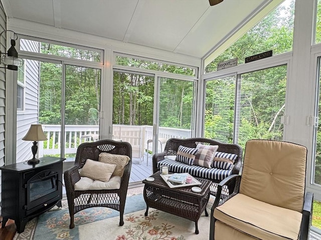 19 Orange Rd, Northfield, MA 01360 - sunroom / solarium featuring an outdoor living space, vaulted ceiling, a ceiling fan, and a wood stove