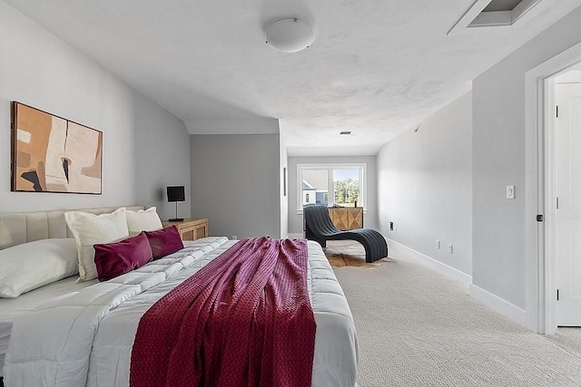 carpeted bedroom featuring baseboards