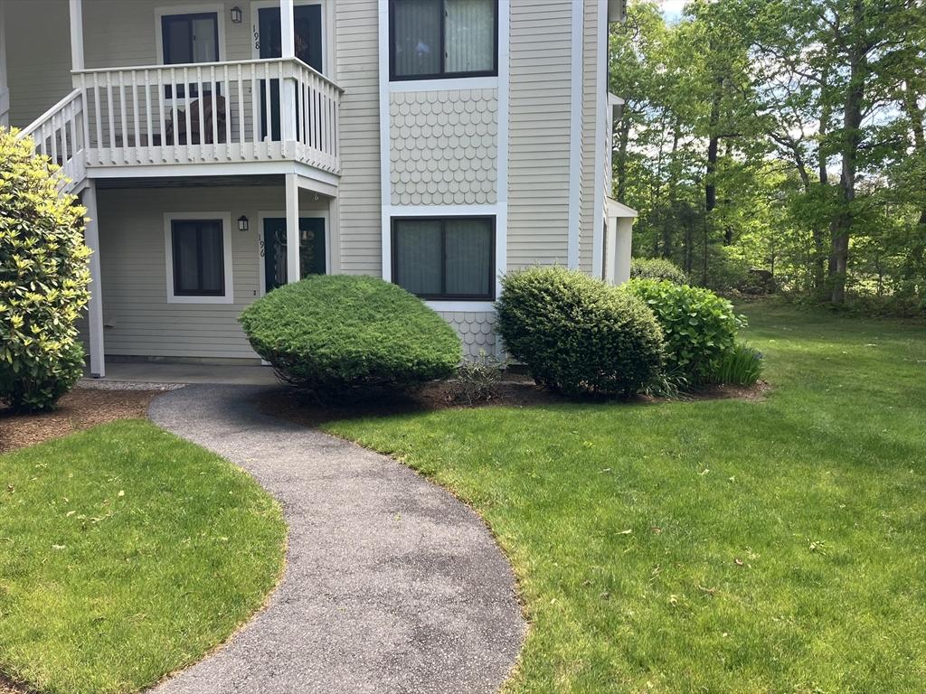 196 Eaton Ln Unit 196, Brewster, MA 02631 - view of side of home featuring a yard