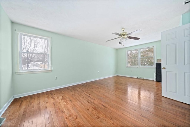 unfurnished living room with light hardwood / wood-style floors and ceiling fan