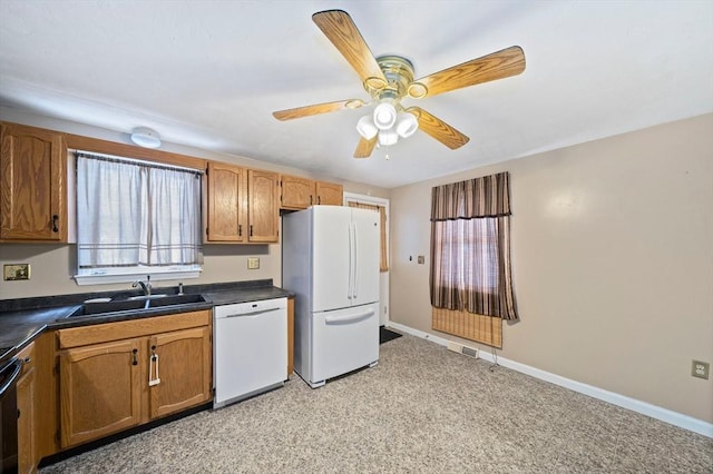 kitchen featuring sink, white appliances, and ceiling fan