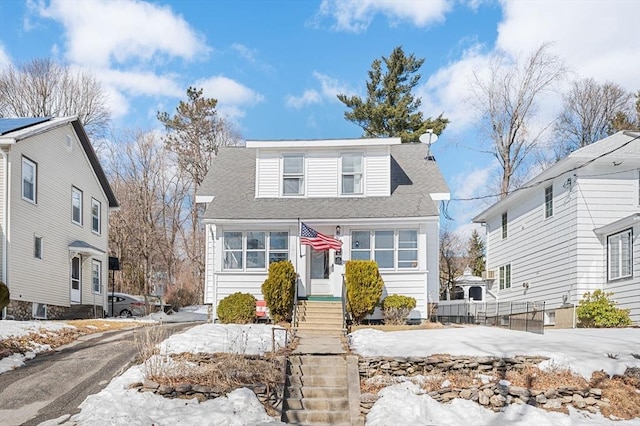 view of front of home featuring roof with shingles